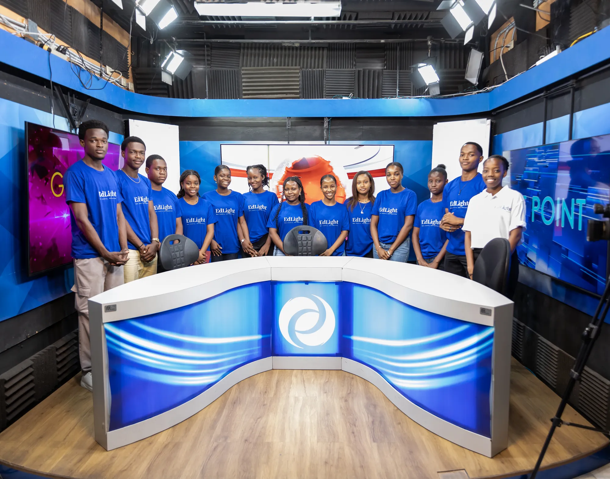 ESLP 2026 fellows on the news set during their visit to Radio Télé Métropole in Port-au-Prince