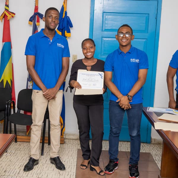 An EdLight learner receiving a certificate